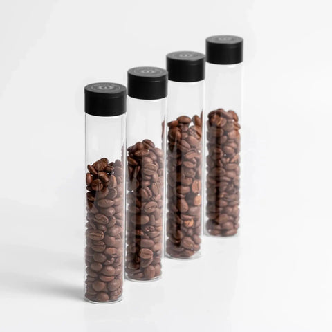 Keep Your Grind Fresh With This Premium Airtight Coffee Bean Storage Tube Set Featuring Four Smart Glass Jars And Clean Counter Display One Way Valve Seals In Aroma For Smooth Daily Brewing - four glass tubes with coffee beans