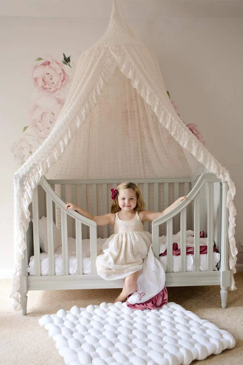 Tot Friendly Cozy Kids Bed Canopy With Lace Chiffon Netting And Pom Poms Dreamy Princess Fairy Tent above nursery crib