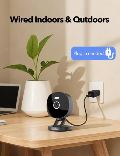 2K Wired Security Camera For Indoor And Outdoor Use With IP65 Weatherproof, Color Night Vision, shown plugged in on a desk.