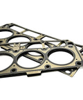 Road Warrior Camshaft Kit Designed For Crushing Stock Horsepower On Chevy Ls Blocks While Delivering Thumping Lower End Torque Using Bold.573 Valve Specs - close-up of multi-layered gaskets.
