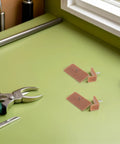 Plastic Drawer Glides And Stoppers For Cabinets, Easy Fix For Sticky Drawers beside tools on green surface