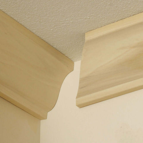 Installed crown molding pieces with clean cope cuts using Speed Cope Crown Molding Jig With Adjustable Handle For DIY Woodworking.