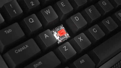 Close-up of red switch on Full Size Mechanical Gaming Keyboard Featuring Top Tier Rgb Lighting And Snappy Red Switches.