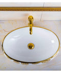 Bathroom Sink Hotel Bathroom Wash Basin Oval Above Table Basin Gold Leaf Flower Art Basin Decorative Wash Basin Bathroom Sink Vessel viewed from above.