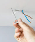 Hand installing a 15 Piece Heavy Duty Toggle Bolts And Wing Nut Kit For Drywall And Concrete Carbon Steel Anchors With Screws