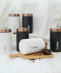 Solid Hella Airtight Metal Coffee Canister Set Keeps Your Beans Fresh And Tastes Dope With Wide Mouth Design, white canister for coffee on wood.