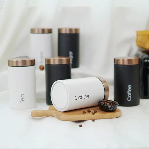 Solid Hella Airtight Metal Coffee Canister Set Keeps Your Beans Fresh And Tastes Dope With Wide Mouth Design, white canister for coffee on wood.