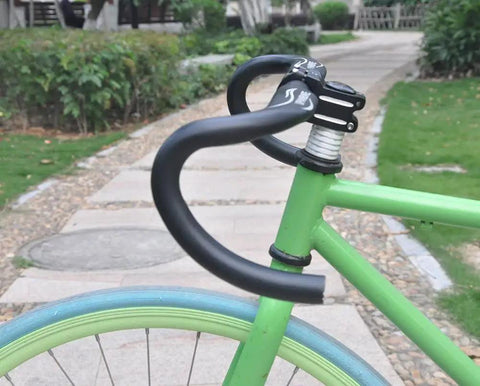 31.8mm Drop Handlebar 420mm Aluminum Alloy 7075 Road And BMX Bike Bar Black attached to green bike