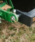 Close-up of 3 Point Single Tine Subsoiler for Cat 1 Tractors hitch mechanism for quick attach on grass backdrop