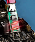 Digital Optocoupler Tester With Type-C USB Interface plugged into a circuit board with glowing LED indicator, showcasing PCB connection.