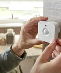 Person installing Indoor Smart Motion Sensor 2 Pack With Daylight Sensing Auto On When You Roll In And Auto Off When You Roll Out