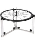 360 Degree Rotating Wheel Truing Stand For Bike Repair, Rim Safe Contact, Foldable For Easy Storage, Fast Wheel Building, Pro And Home Mechanic Friendly visible in metal frame holding bicycle wheel.