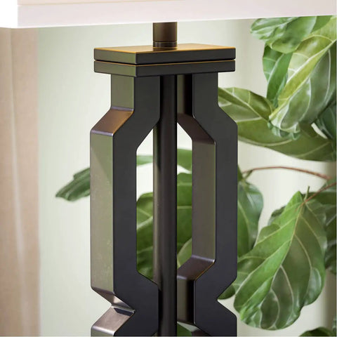 Close-up of a Tall Black Floor Lamp With White Rectangular Shade, 59.5 Inch Height, plastic construction, next to plants.