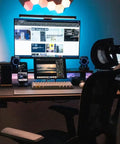 Hexagon RGB LED wall panels above a gaming setup, showcasing the Dope Hexagon LED Wall Lights Kit with Remote and Touch Control.
