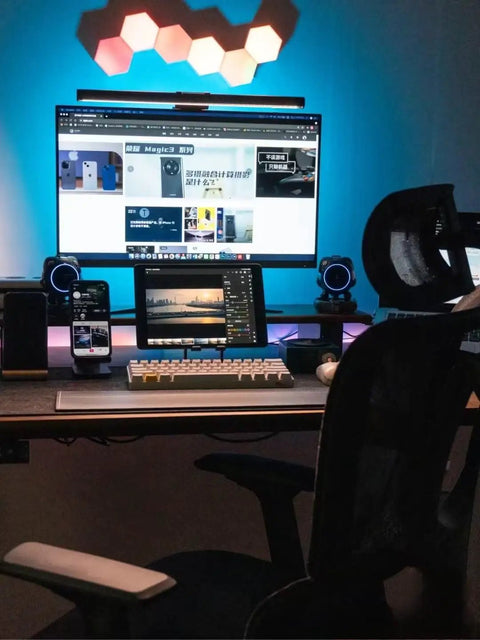 Hexagon RGB LED wall panels above a gaming setup, showcasing the Dope Hexagon LED Wall Lights Kit with Remote and Touch Control.