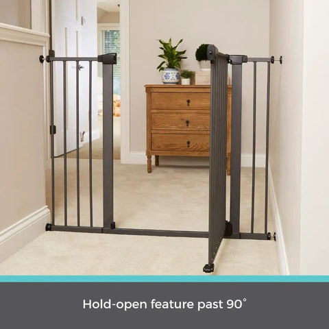 Extra Tall And Wide Pressure Mounted Baby Gate for Doorways in graphite finish, adjustable 29.75 to 52 inches wide, shown in hallway.