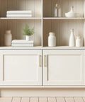 White cabinet with shelves, decorated with ceramics, featuring 10 Pack Five Inch Champagne Bronze Cabinet Pulls Solid Zinc Alloy For Kitchen Cabinets Dressers Closets And Bathroom Hardware Modern Boss Ready Cabinet Handles For Drawers.