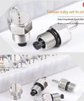 Close-up of a four-piece metal high-pressure cleaning nozzle set with threaded fittings and O-rings.