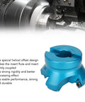Blue aluminum CNC lathe face mill adapter with clamp, for four-flute milling, shown with metal lathe in background