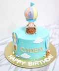 Birthday cake with 'Caden' and fondant details made using 13 Piece Hot Air Balloon and Cloud Fondant Cutter Set for Cakes and Cookies Plastic Cookie Cutters for Cake Toppers Sugar Craft and Polymer Clay DIY Decorating Kit