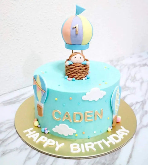 Birthday cake with 'Caden' and fondant details made using 13 Piece Hot Air Balloon and Cloud Fondant Cutter Set for Cakes and Cookies Plastic Cookie Cutters for Cake Toppers Sugar Craft and Polymer Clay DIY Decorating Kit