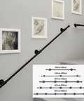 Heavy Duty Wrought Iron Grab Rail Outdoor Stair Handrail Black Anti Rust mounted on a wall with artwork, ideal for safety.