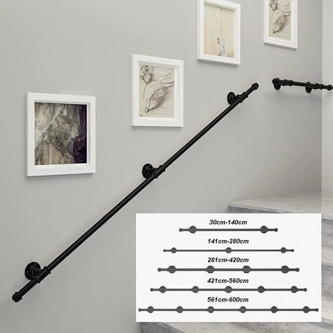 Heavy Duty Wrought Iron Grab Rail Outdoor Stair Handrail Black Anti Rust mounted on a wall with artwork, ideal for safety.