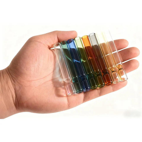 Hand holding Colored Borosilicate Glass Blowing Tubes 8 Piece Set Heavy Duty High Temp Resistant For Industrial Lab And Craft Projects.