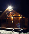 Led Barn Light Outdoor Flood Security Light 42W 5000K Dusk To Dawn LED Flood illuminating a wooden porch at night