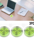 3PCS 32mm Circular for spirit Level Bubble for Furniture Placement and on wooden desk near laptop and paperwork.