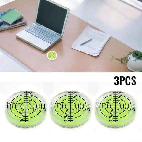 3PCS 32mm Circular for spirit Level Bubble for Furniture Placement and on wooden desk near laptop and paperwork.