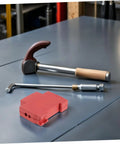 Ironclad Snap In Fire Suppression Case Featuring Condensed Aerosol Extinguisher Housing A Four Piece Kit on workbench with tools.