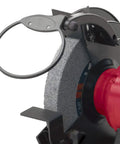 Powerful Eight Inch Bench Grinder Boots Kickin Three Quarter Horsepower Motor focus on grinding wheel with protective guard.
