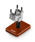 Slick Mini Bench Vise Featuring Sweet 360 Degree Rotating Ball Joint Base, Legit Aluminum Alloy Table Top Hobby Clamp Offering Flexible Multi Angle Tilting And Secure Grip For Gunpla Assembly Jewelry Repair Electronics Soldering Work, Rich Red on a brown base.