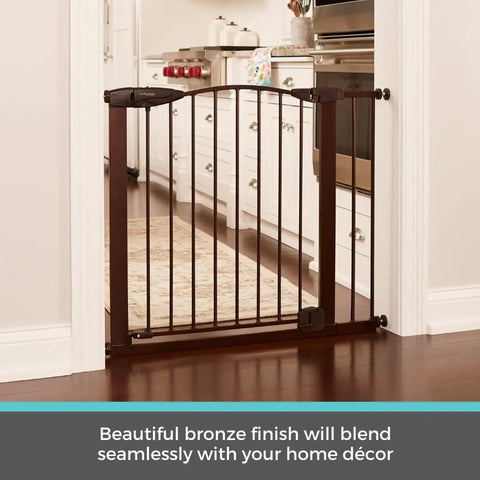 Stone Arch Auto Close Baby Gate For Doorways Bronze Metal Safety Gate installed in a kitchen doorway, showcasing sturdy construction.