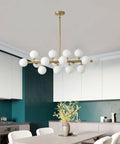 Modern sputnik chandelier with white globes over kitchen table in stylish dining room