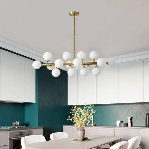 Modern sputnik chandelier with white globes over kitchen table in stylish dining room