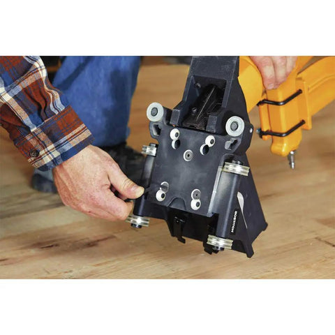 Person installing Flooring Nailer Rolling Base With Tool Free Thickness Adjustment from one half to three quarters inch on floor