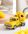 Farmhouse Sunflower Truck Decor Set Of Two That Is Perfect For Tiered Trays Mantel Or Shelf Displays Yellow Metal Diecast Pickup With Mini Sunflower Bouquet For Vintage Charm features close-up of yellow truck on white surface.