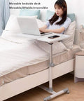 Smooth Rolling Tilt Top Height Adjustable Standing Desk With Heavy Duty Carbon Steel Frame And Locking Wheels For Seamless Over Bed Workstations And Lowkey Productive Home Office Vibes with a user working on a laptop.