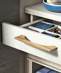 Modern drawer with 4 Pack Brushed Gold Cabinet Drawer Pulls in Zinc Alloy with Brushed Brass Finish, installed on wooden dresser