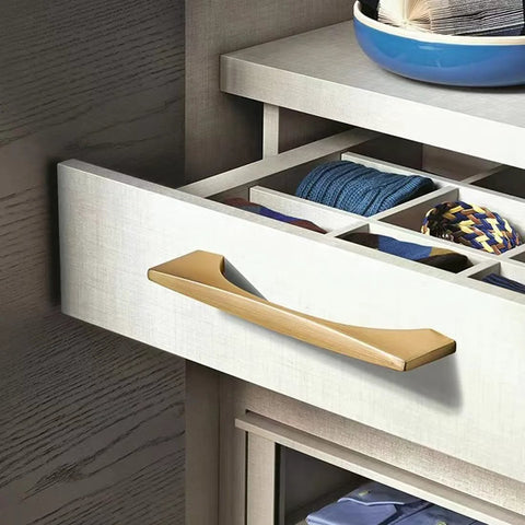 Modern drawer with 4 Pack Brushed Gold Cabinet Drawer Pulls in Zinc Alloy with Brushed Brass Finish, installed on wooden dresser