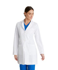 Women's 3 Pocket Lab Coat 32 Inch White 3X Large Soft Touch Fabric, worn by a woman, side angle view.