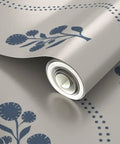 Kick Up Walls With Cottage Floral Blue And Silver Metallic Wallpaper Featuring Slick Fibrous Texture And Glamorous Shine, coiled roll detail.