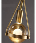 Slick Premium Copper LED Wall Sconce Featuring Glare Free Crystal Shade For Modern Bedroom Bedside Hallway And Staircase Decor With Tight Rust Proof Build And Killer Warm Ambient Glow close-up of metallic fixture with glass globe.