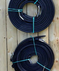 Coiled lines of Full Size Leather Horse Driving Harness With Red Trim, Premium Quality Horse Driving Equipment on wooden floor.