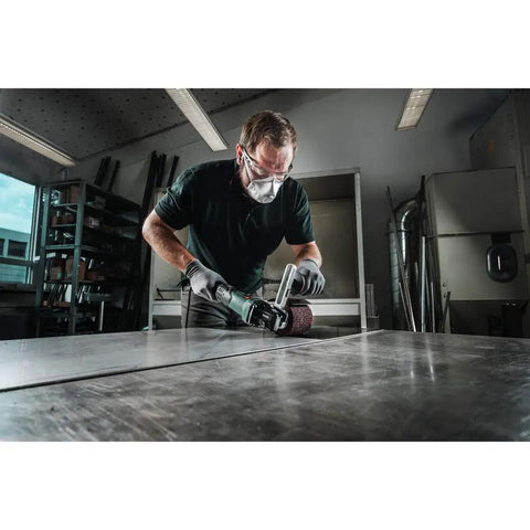 Man using 4 Inch Variable Speed Burnisher Kit With 800 To 3000 RPM, 14.5 Amp Power, Lock On Handle, SE 17-200 RT Set on metal