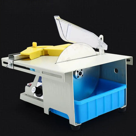 Heavy Duty Benchtop Table Saw With Rip Through Power For Wood And Metal, side view showcasing yellow control and blue container.