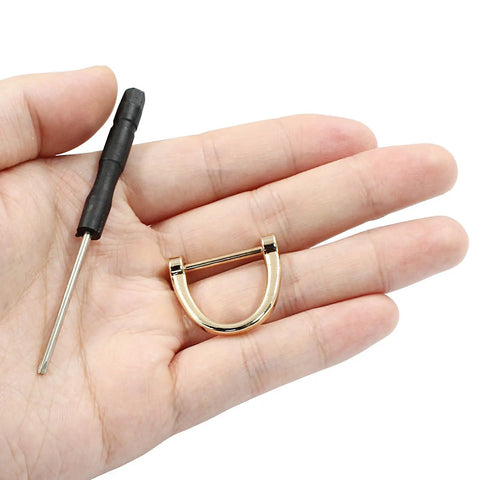 Heavy Duty Gold U Shape D Ring Screw Eyes 15 Pack Rust Resistant Alloy Strap Hardware For Bags Saddlery And Rigging Snap On Hassle Free Rock Solid Gear Upgrade in hand with screwdriver.