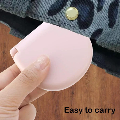 Hand holding light pink compact case of Two Pack Mini Travel Sewing Kit Set, Grab And Go DIY Supplies In A Compact Plastic Case With Threads